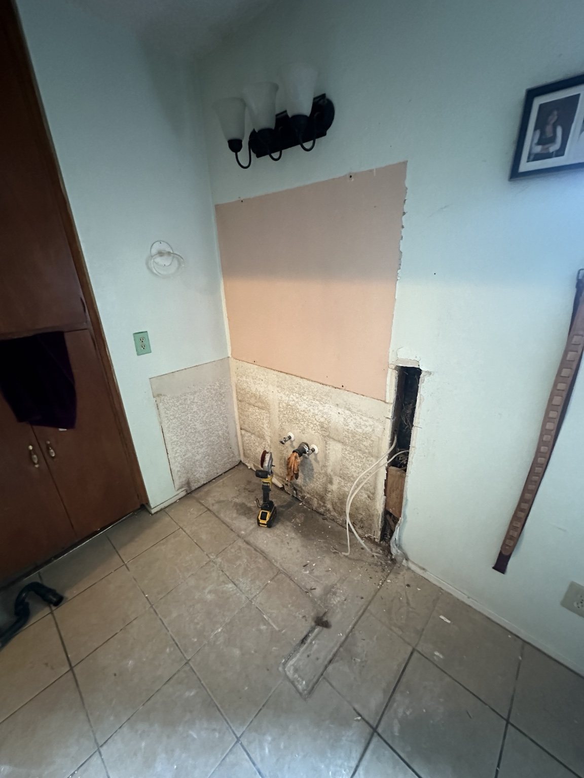 Bathroom vanity area during demolition
