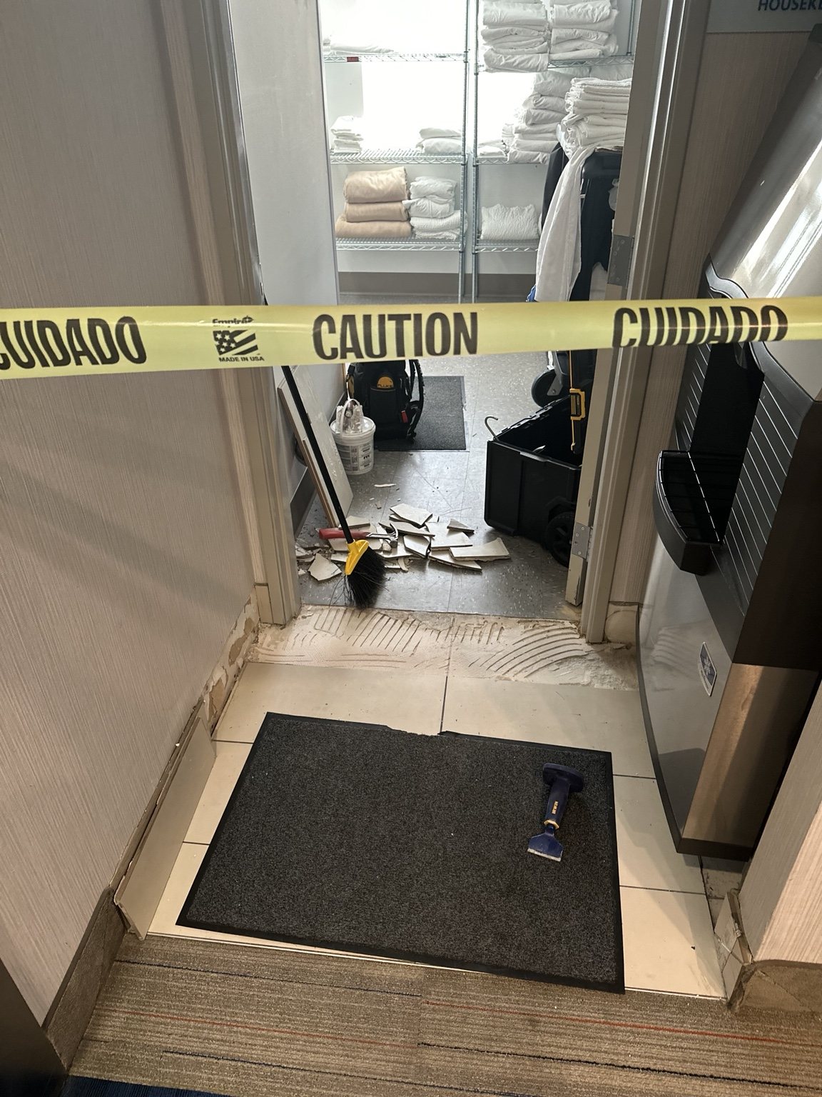 Commercial doorway tile repair before replacement