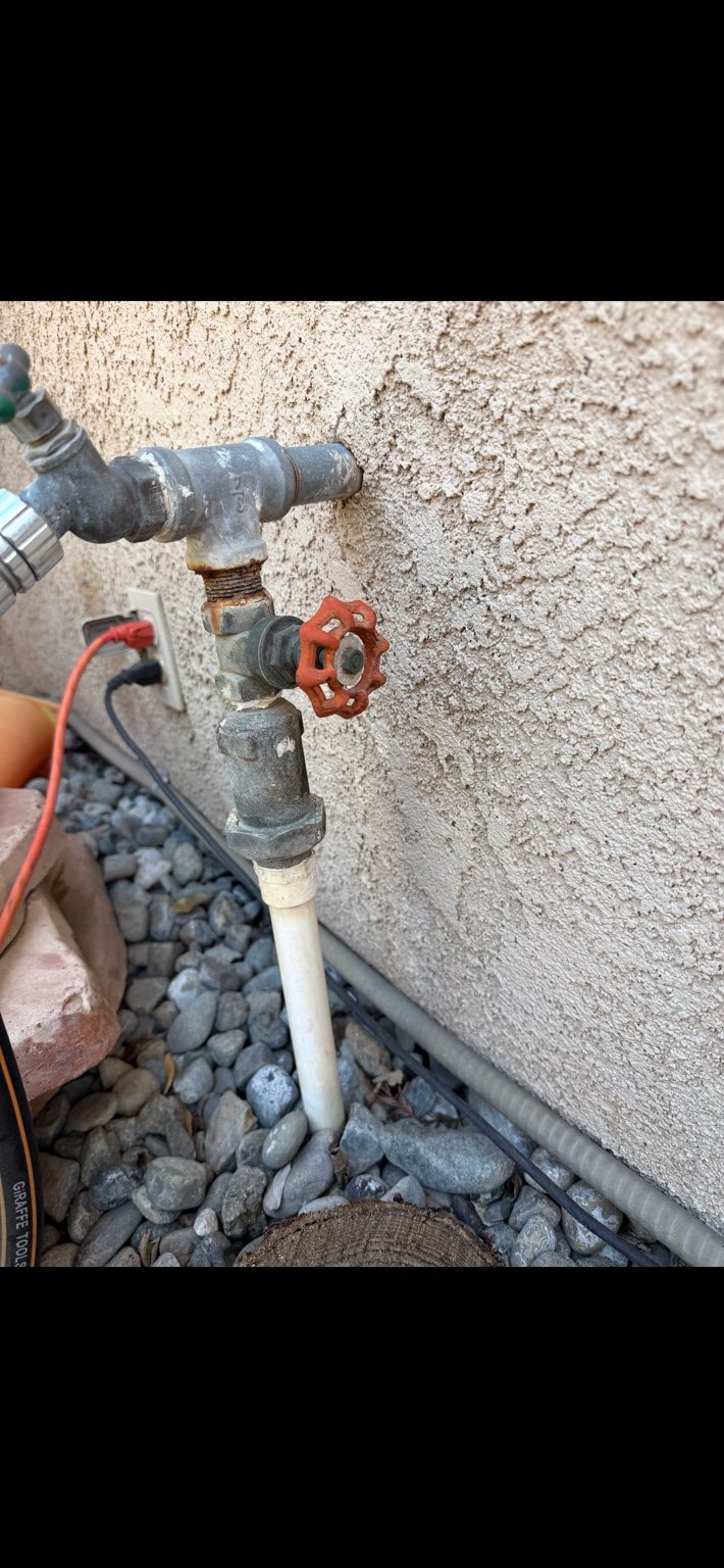 Older exterior hose bib and valve before replacement